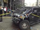 Hummer is smashed from the storefront impact